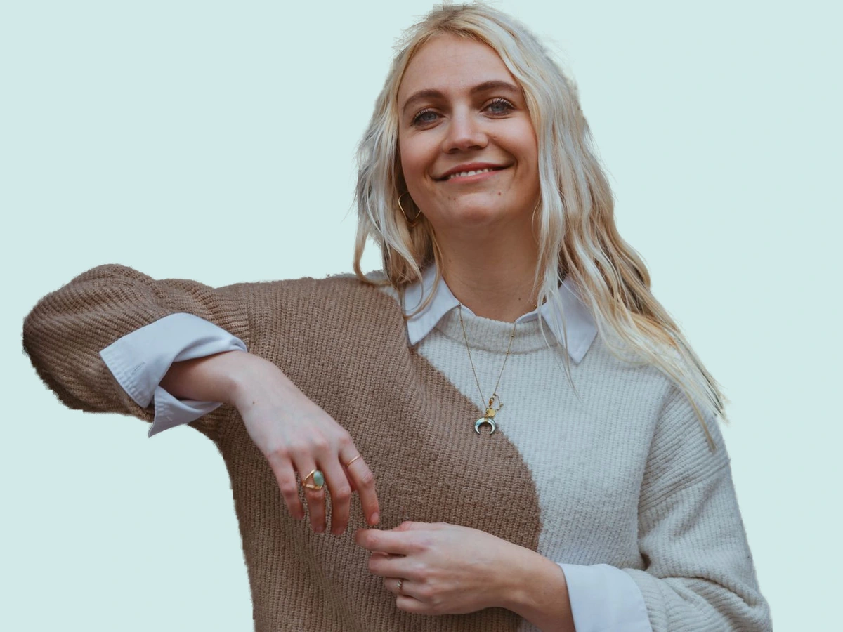 Street portrait with a soft green background after