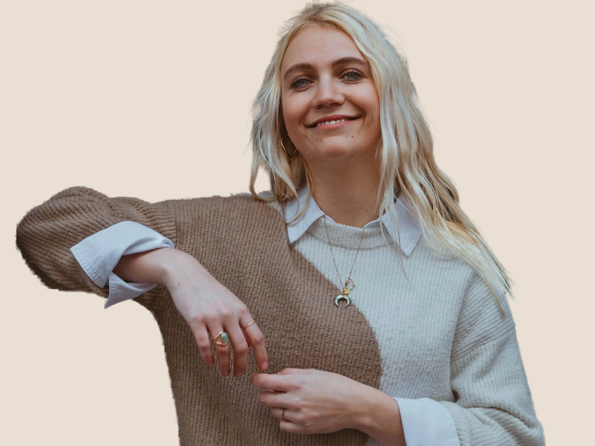 Street portrait with a warm neutral background after