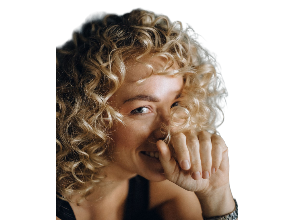 Blonde curls against a white background after